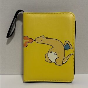 Yellow Pokémon-themed trading card binder featuring Dragonite breathing fire